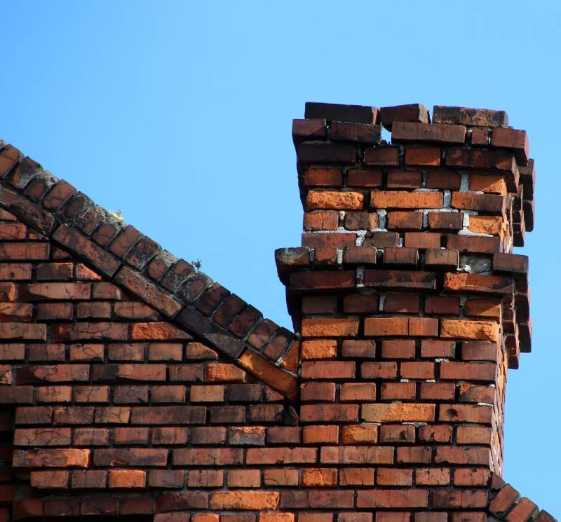 Damaged chimney on an Walkersville home showing cracks and missing mortar